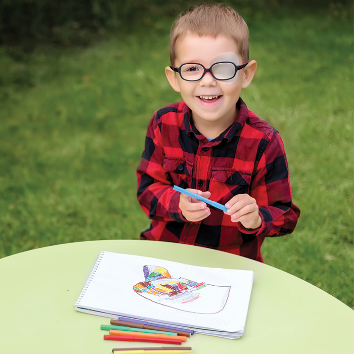 little boy wearing eye patch